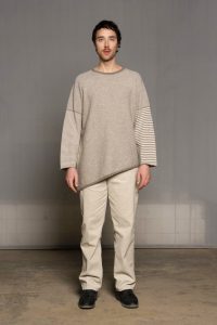 Deconstructed beige unisex poncho/pullover from sustainable sartuul sheep.