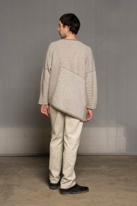 Deconstructed beige unisex poncho/pullover from sustainable sartuul sheep.