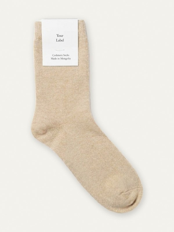 12 gauge cashmere sock in beige with a Your Label paper tag